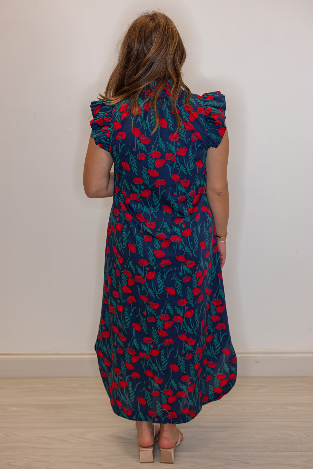 Womens trendy navy blue button front midi dress with red floral print by Entro showing full back view