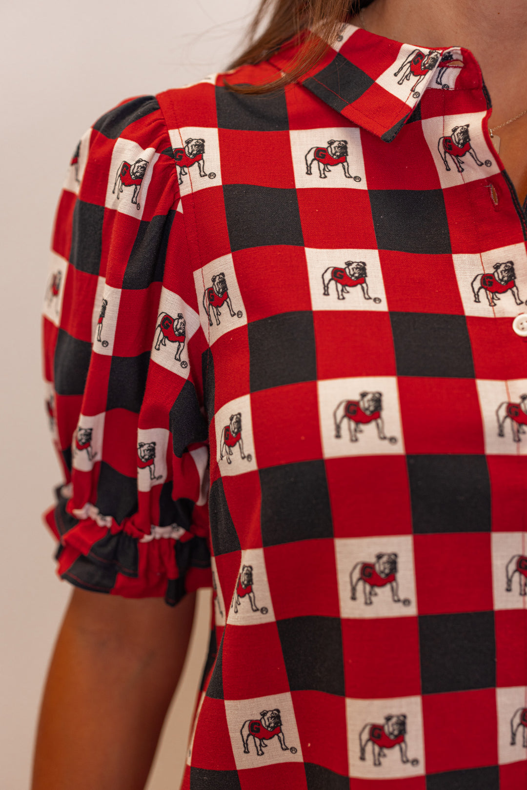  Women's red and black checkered linen dress with UGA bulldog print by Stewart Simmons showing up close view of gingham and bulldog print