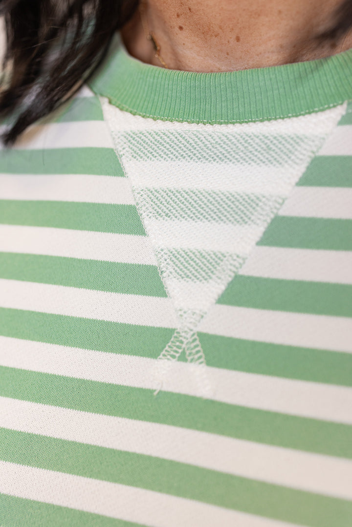 Women's mint and white striped terry knit boxy top by Wishlist showing crew neckline and v-stitched detail