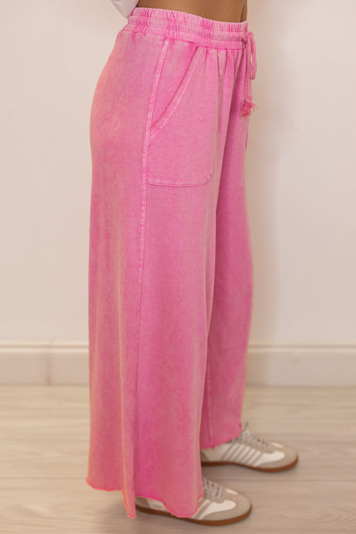 Women's mineral washed barbie pink french terry knit wide leg cropped pants showing up close side view