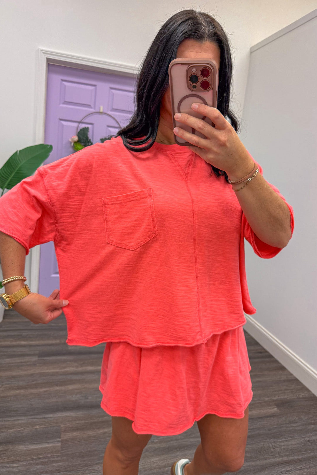 Women's coral athleisure top with matching skort