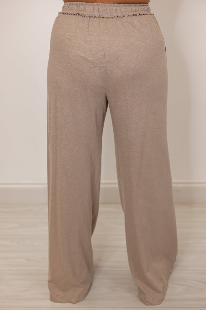 Back view of Beige lounge pants with drawstring waistband