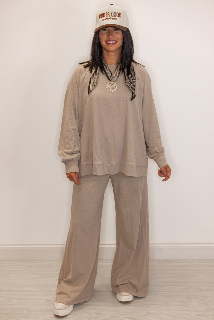 Women's beige active pants with matching crew neck top