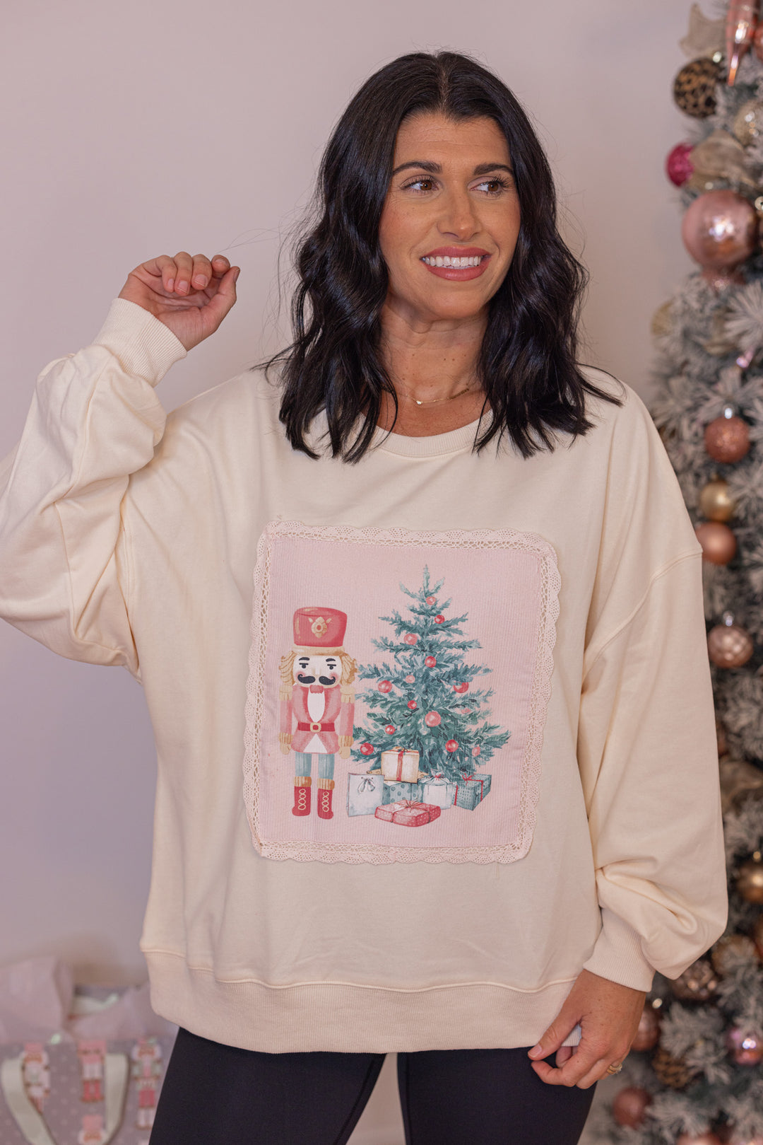 Women&#39;s cream corduroy patch sweatshirt with a nutcracker and Christmas tree by Peach Love California 