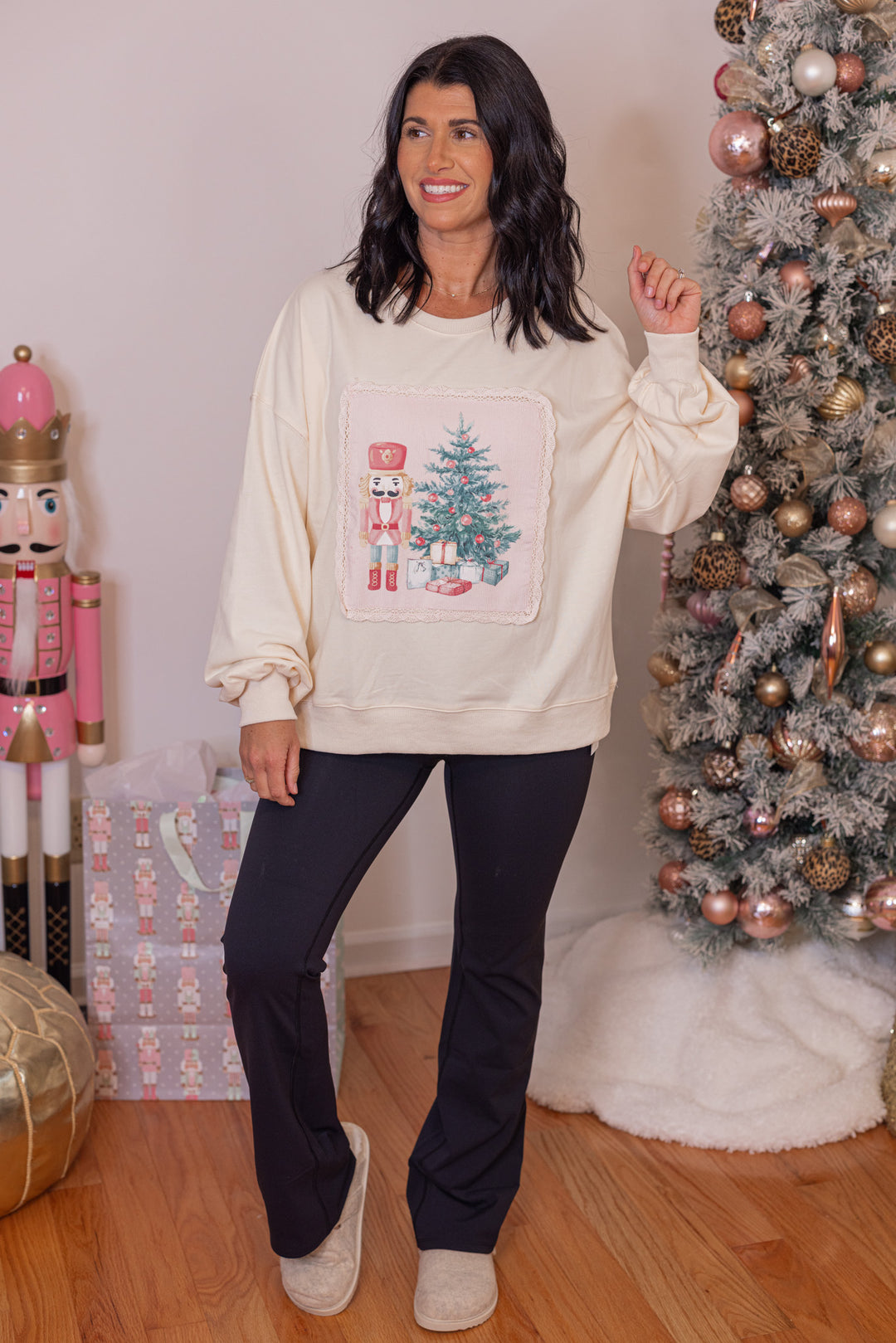 Women's cream corduroy patch sweatshirt with a nutcracker and Christmas tree by Peach Love California showing full front view