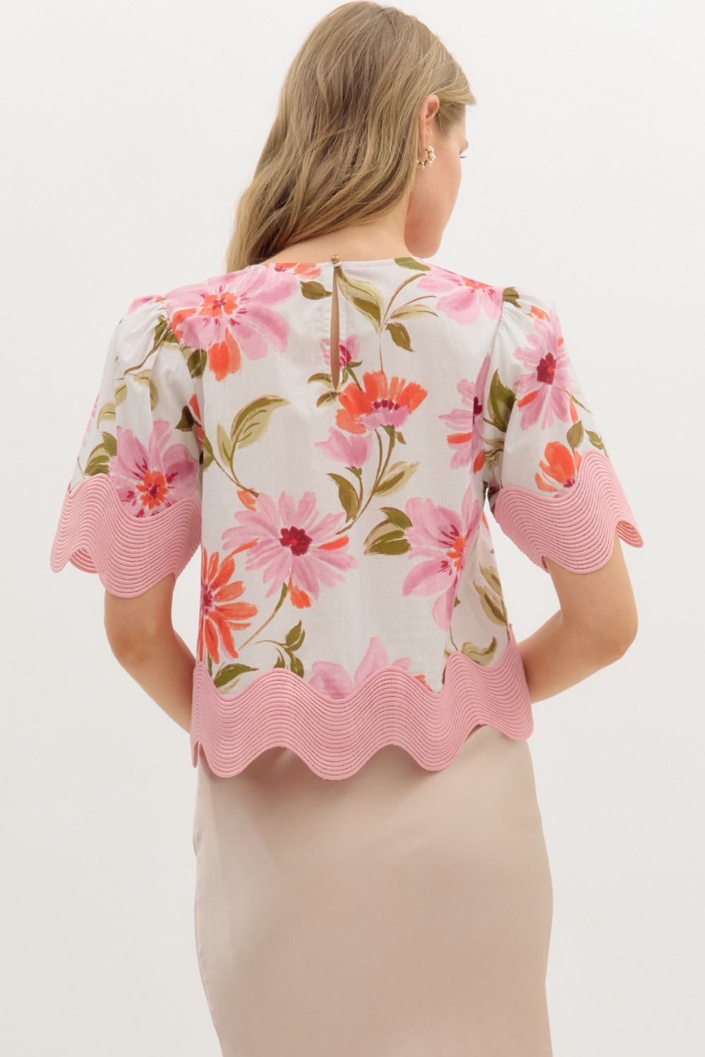 Women's cream and pink floral top with scalloped trim by Entro showing back view