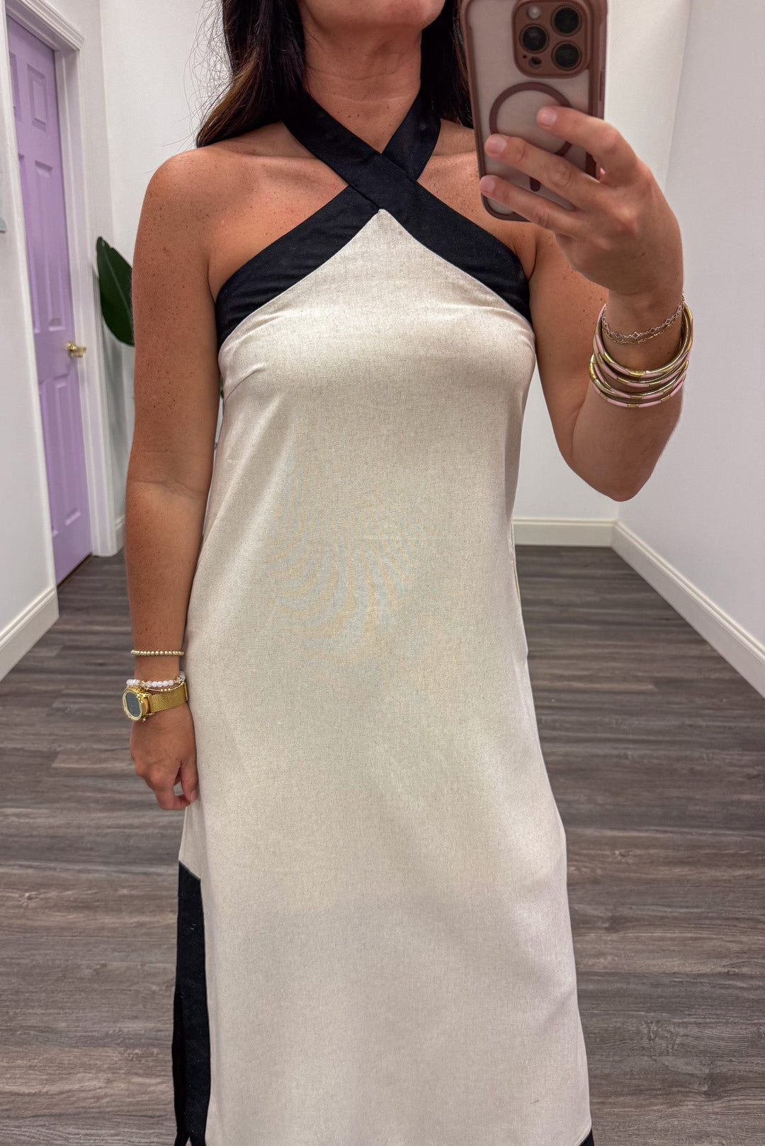 cream with black trim sleeveless halter crew neckline midi dress