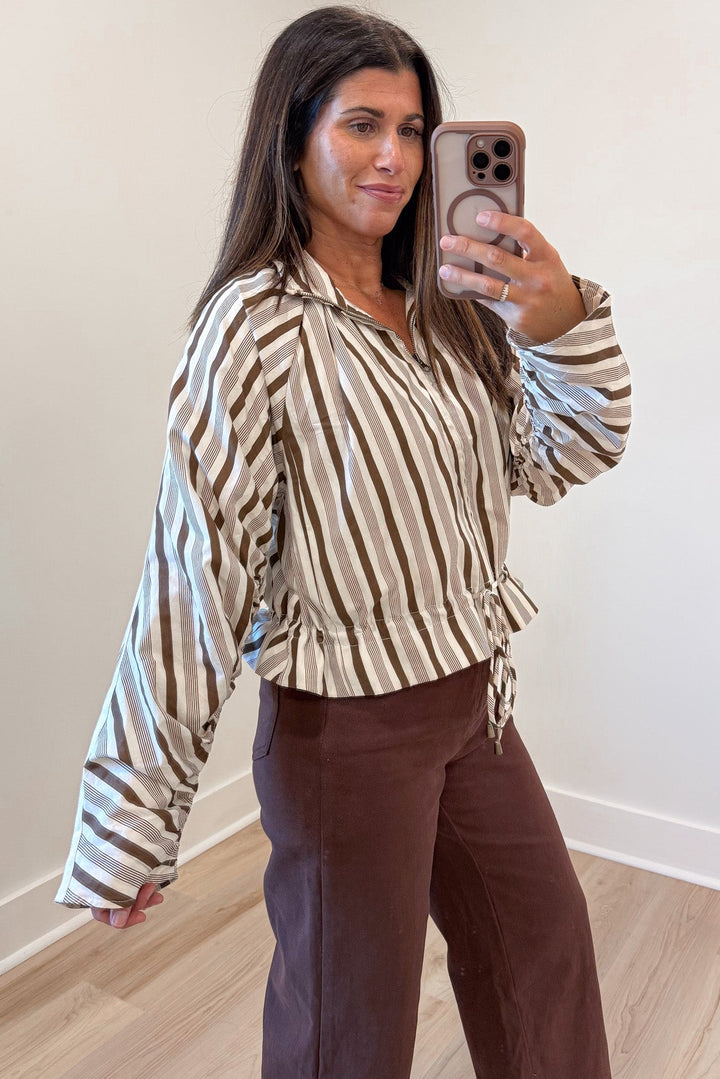 cream and brown striped long sleeve zipper front semi-cropped jacket top with ruffled bottom hem
