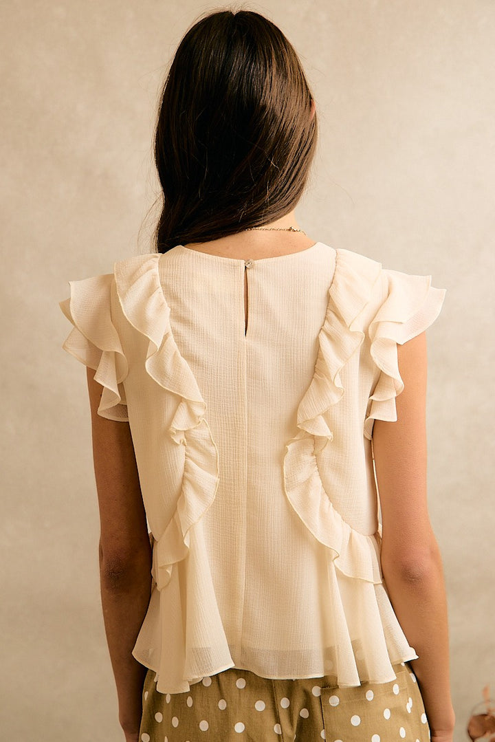 Cream chiffon ruffled top with a flattering silhouette