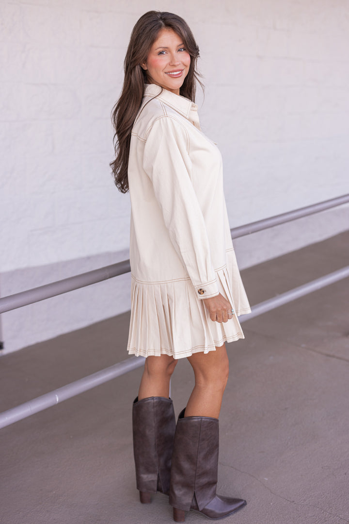 Women's ecru denim twill button front dress with brown stitching trim by Entro showing full side view