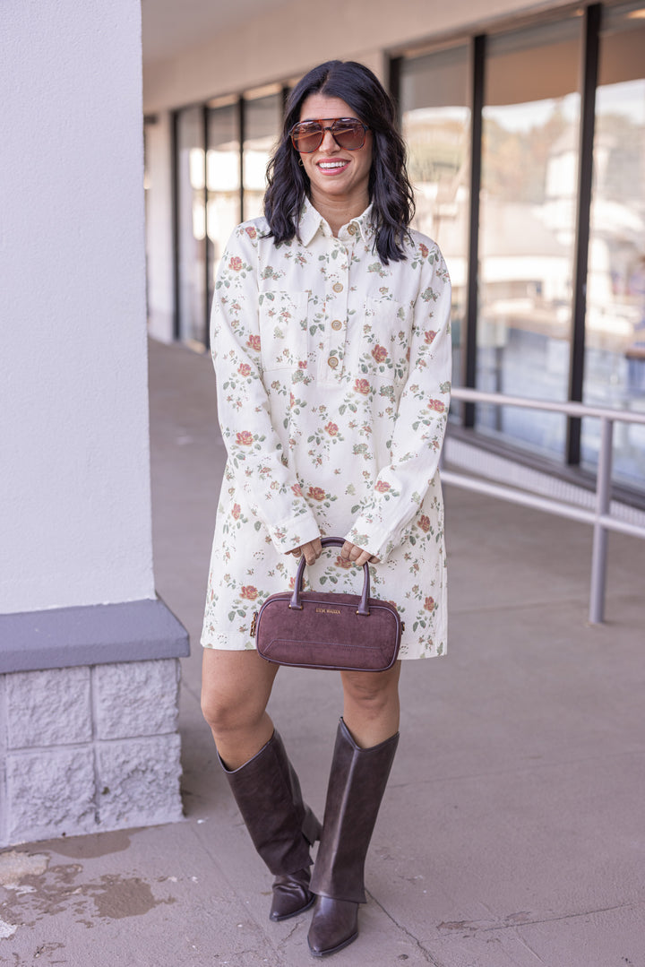 Women's cream denim floral print dress with button front bodice by In February showing button details showing full front view