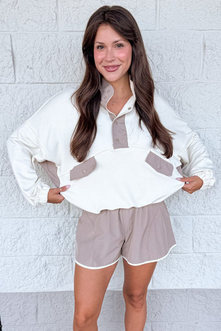 cream with mocha colorblock details snap bodice long sleeve pullover with banded bottom hem