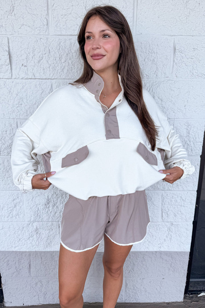 cream with mocha colorblock details snap bodice long sleeve relaxed silhouette pullover