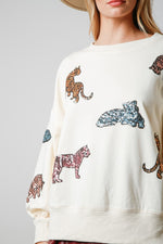 Peach Love California Cream french terry pullover sweatshirt with multicolor sequin tiger print