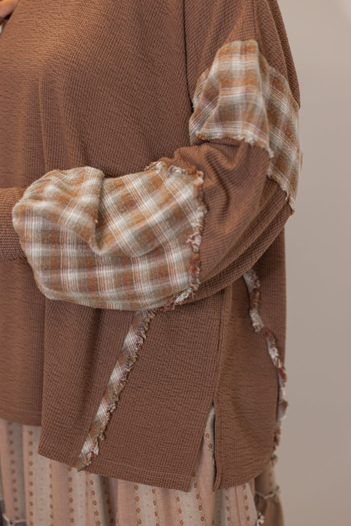 women's Brown textured knit top with plaid trimmed sleeves 