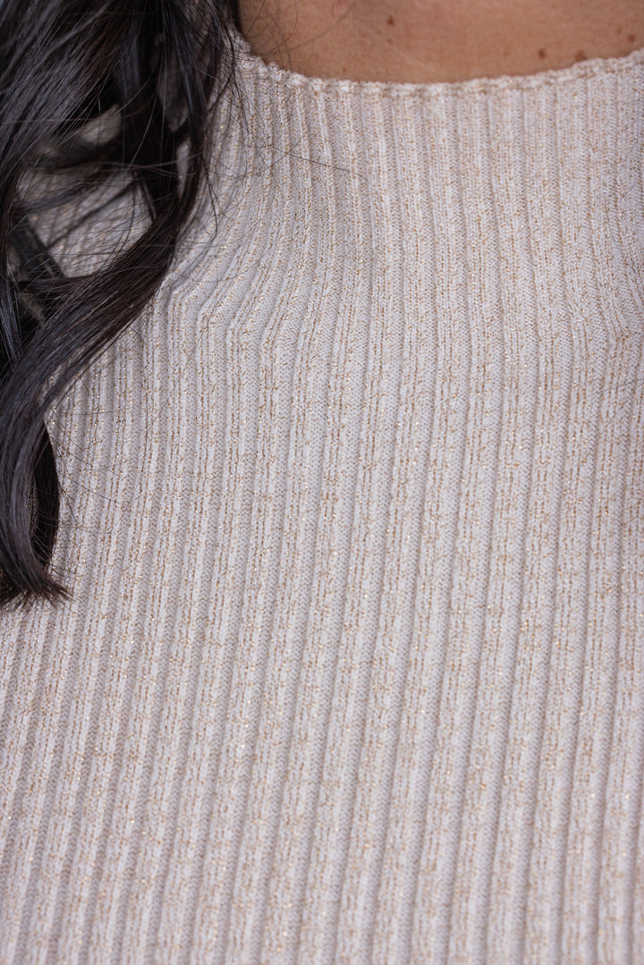 Women's champagne ribbed knit top with gold metallic glitter details by So Me showing ribbed knit fabric