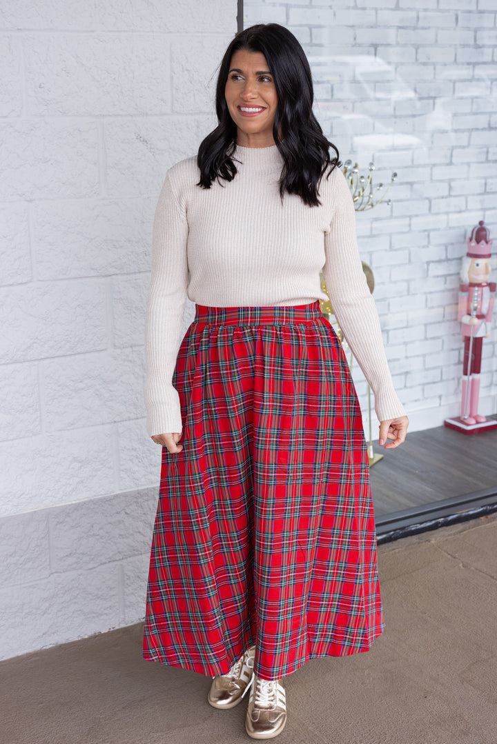 Women's champagne ribbed knit top with gold metallic glitter details by So Me shown styled for the holidays