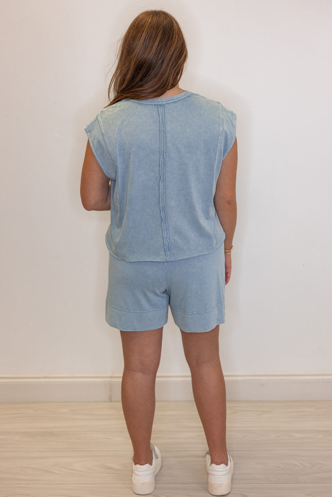 Women's mineral washed utility blue knit shorts by Rae Mode showing full back view