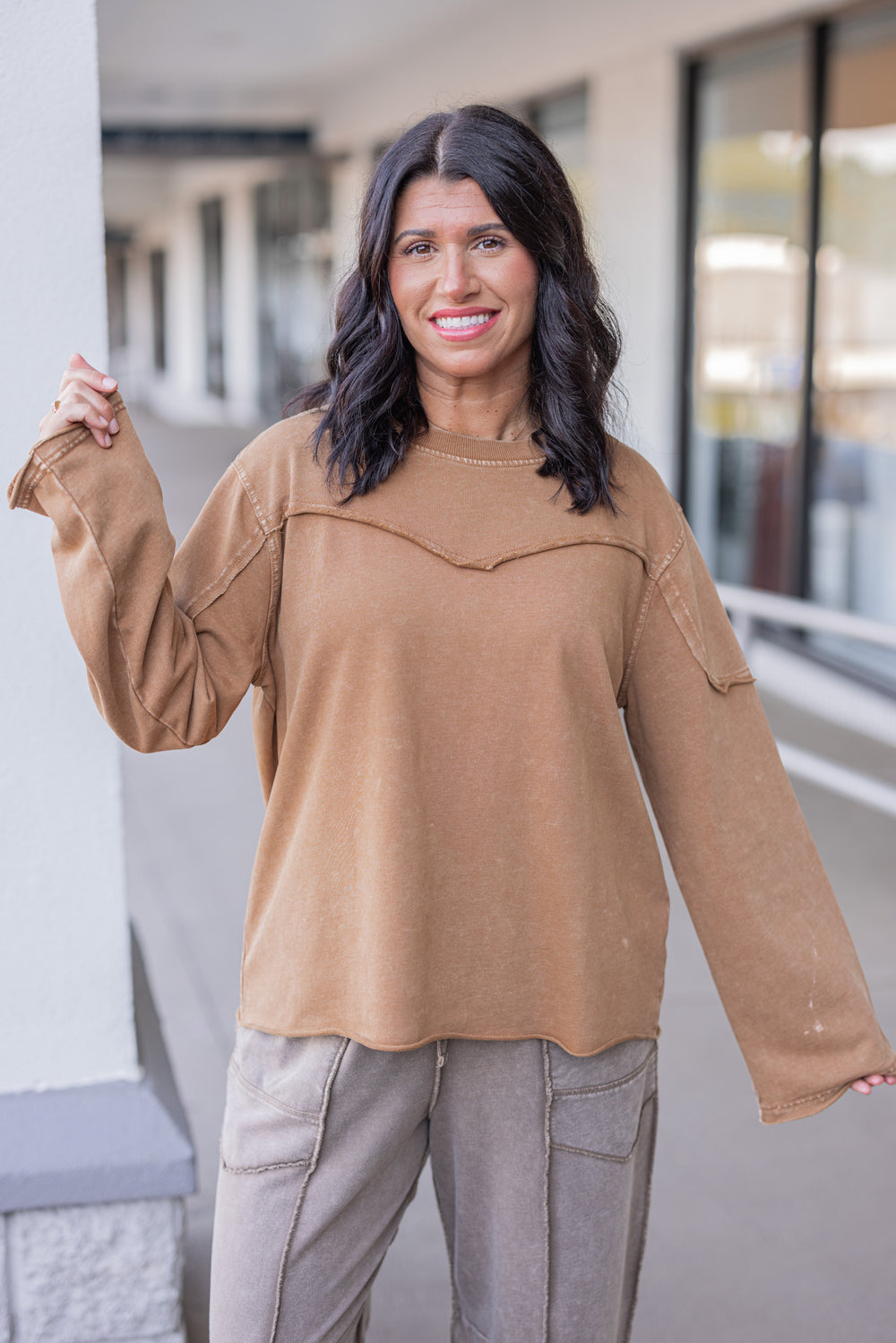 Women's mineral washed caramel terry knit pullover with raw/reverse seam details by Easel showing up close front view