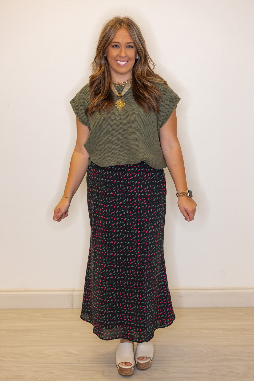 Women's olive green short sleeve sweater knit top by Wishlist shown styled with a skirt