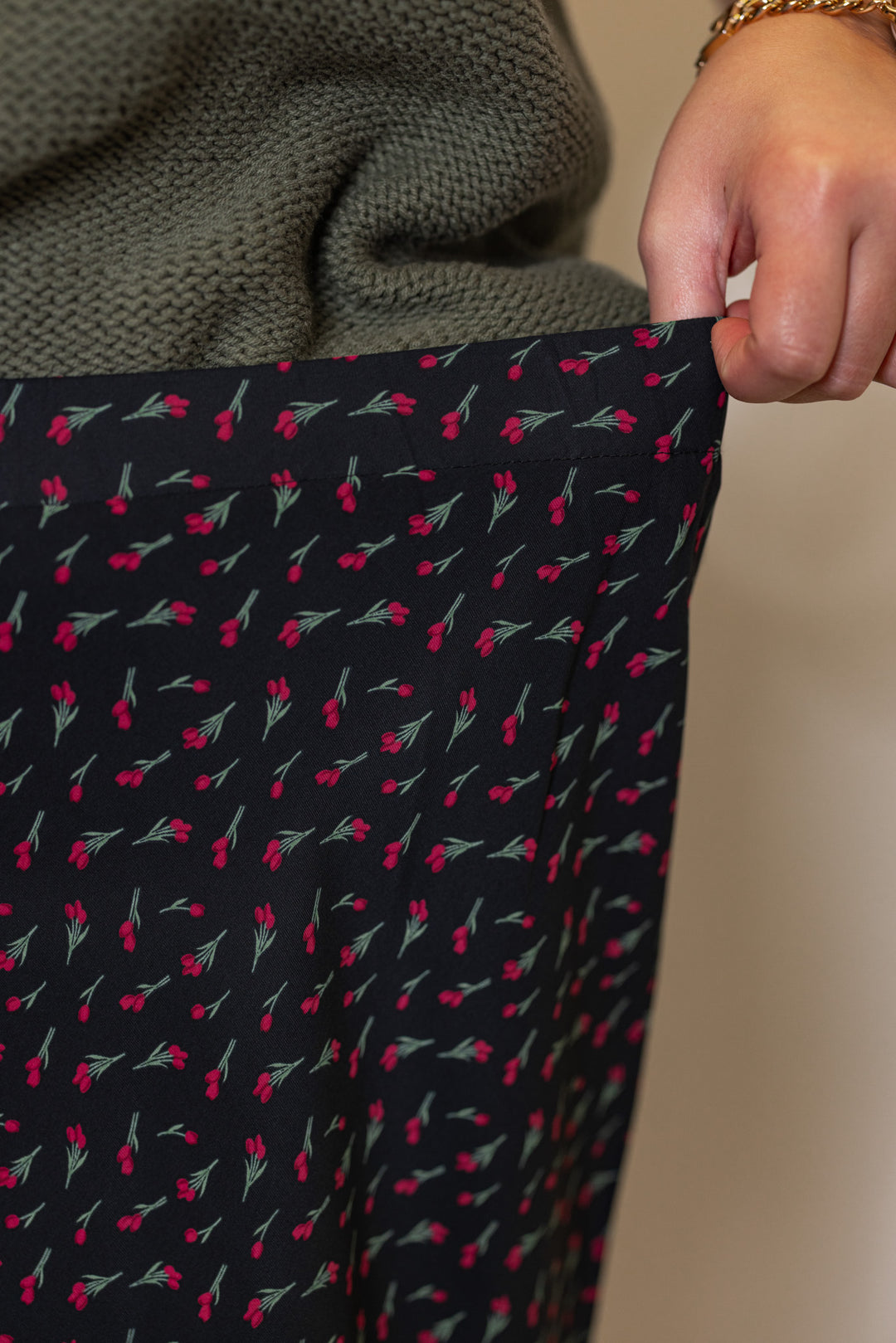 Women's olive burgundy floral black midi skirt by Wishlist showing elastic waistband