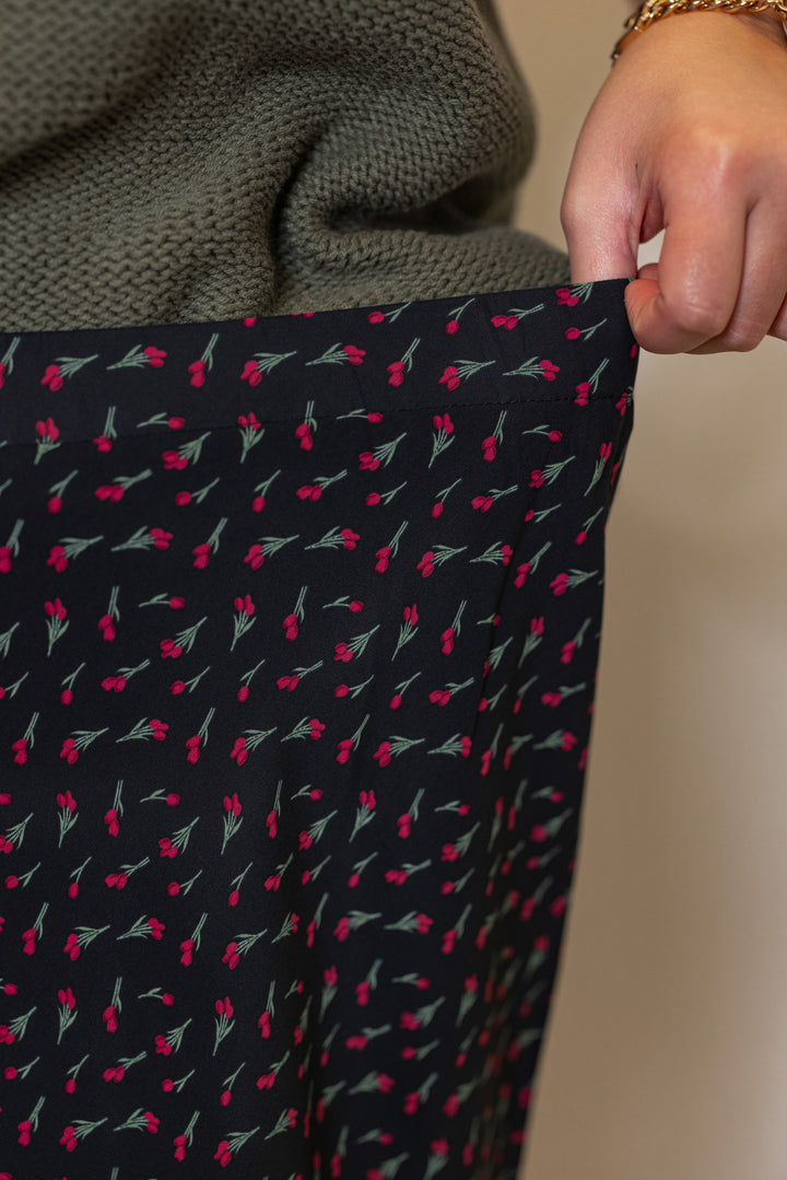 Women's olive burgundy floral black midi skirt by Wishlist showing elastic waistband