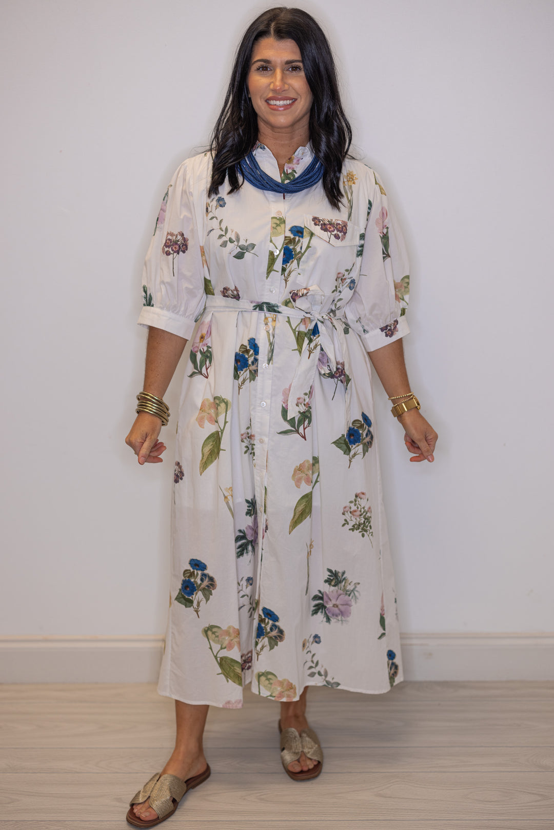 Women's off white floral print button front midi dress with belted waist by Entro