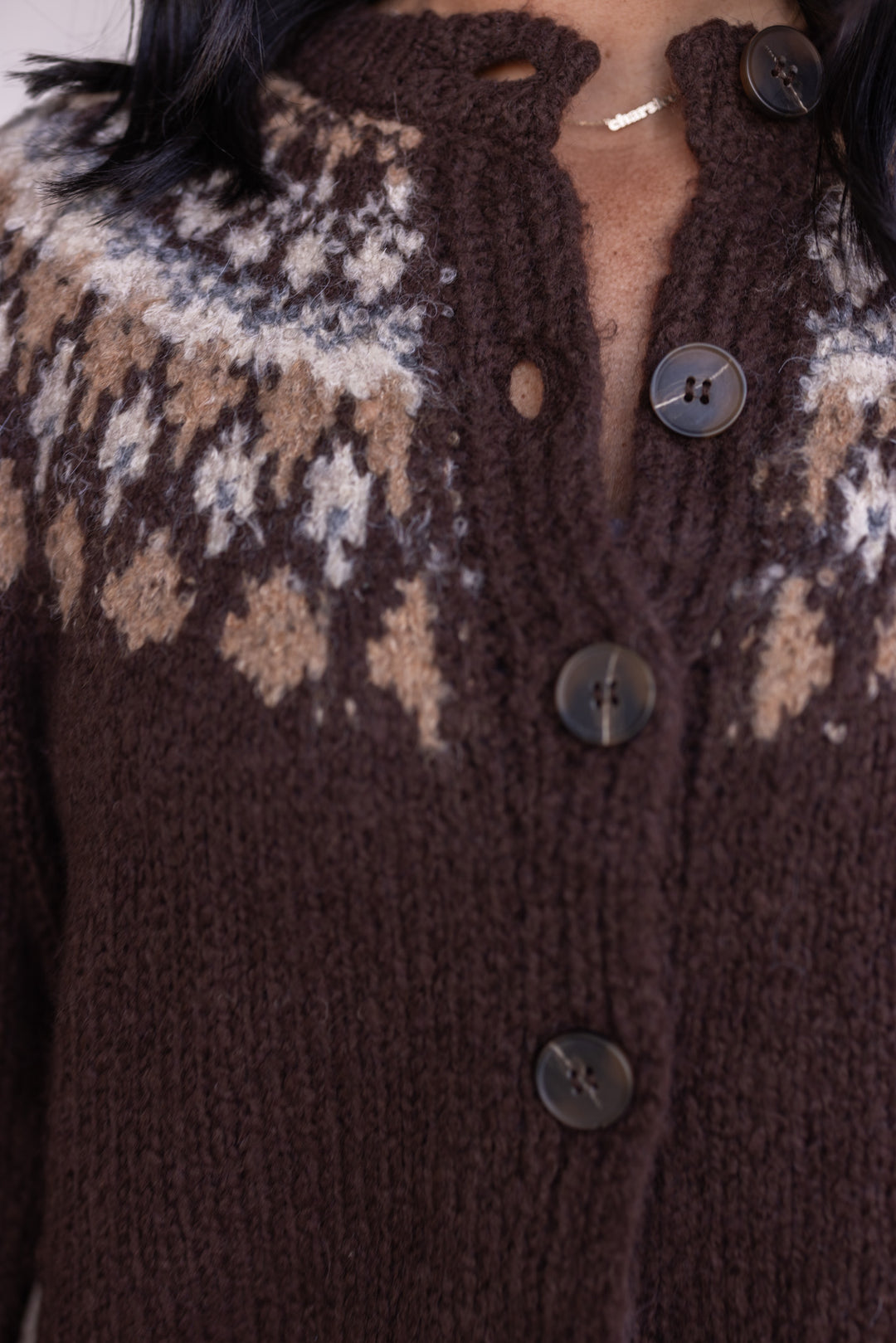 Women's brown button front sweater cardigan with print around the shoulders by Blu Pepper showing button details