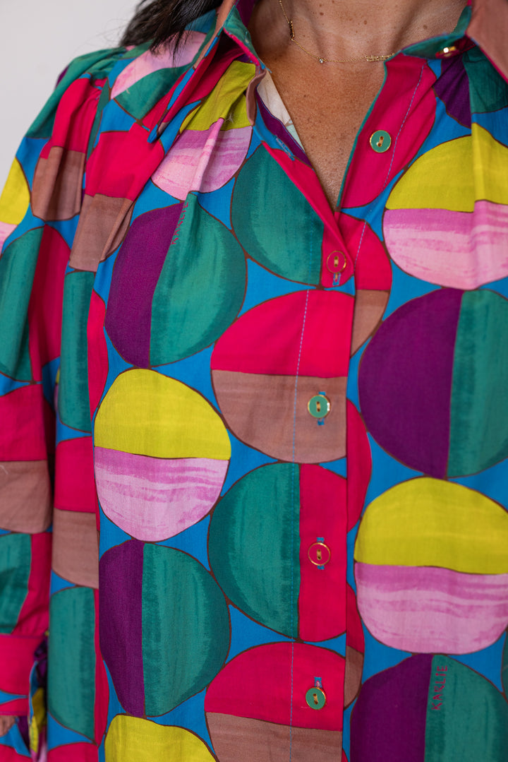 Women's hot pink and multicolor print button front poplin top by Karlie showing up close view of button front detail