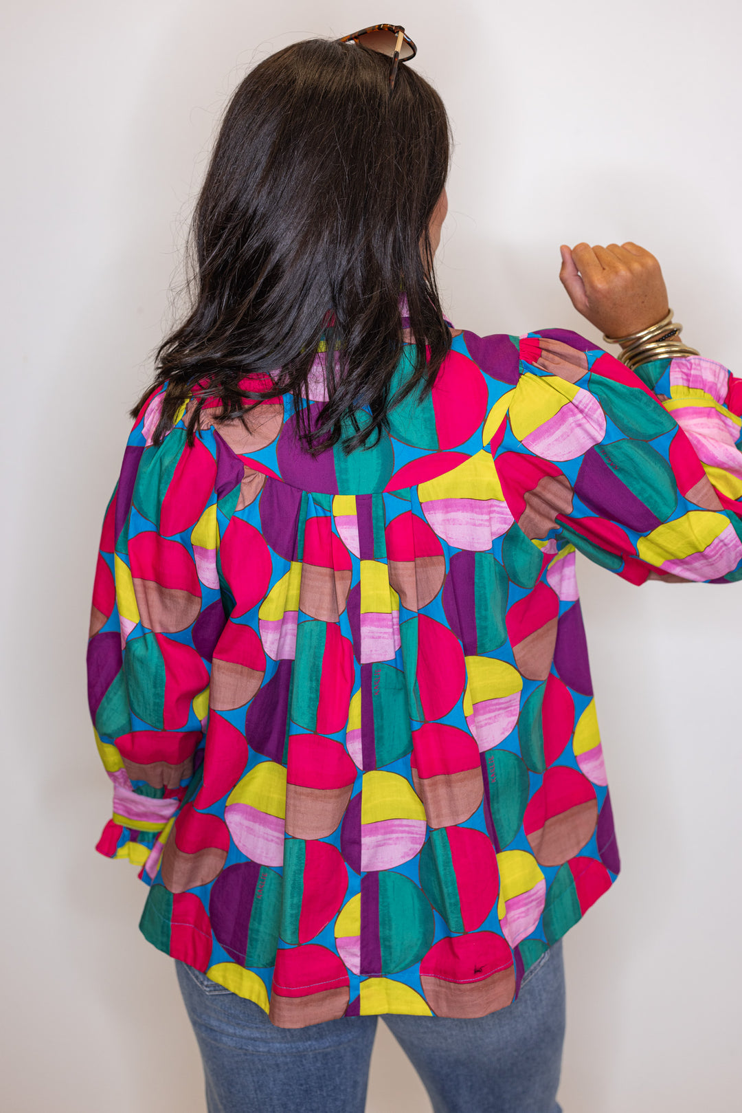 Women's hot pink and multicolor print button front poplin top by Karlie showing back view