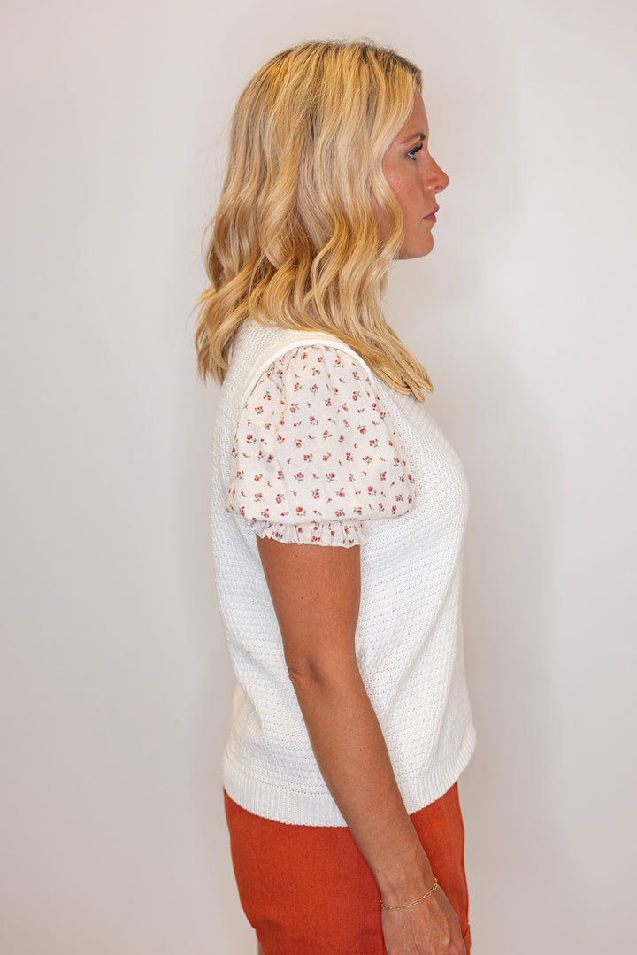 Cream lightweight textured sweater knit top with red floral print puff sleeves by Wishlist showing side view