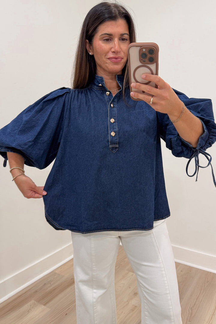 solid dark blue denim 3/4 length puff sleeve mock neckline button front bodice relaxed silhouette top