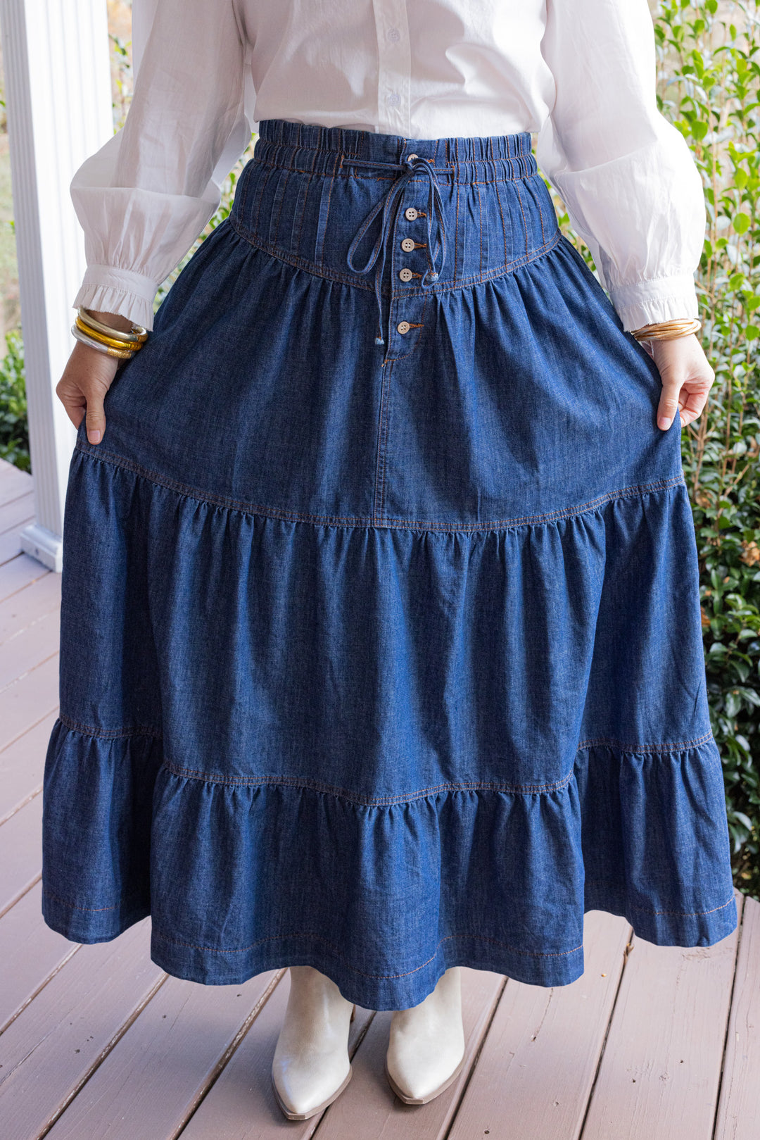 Dark denim maxi skirt by Peach Love California showing tiered style design