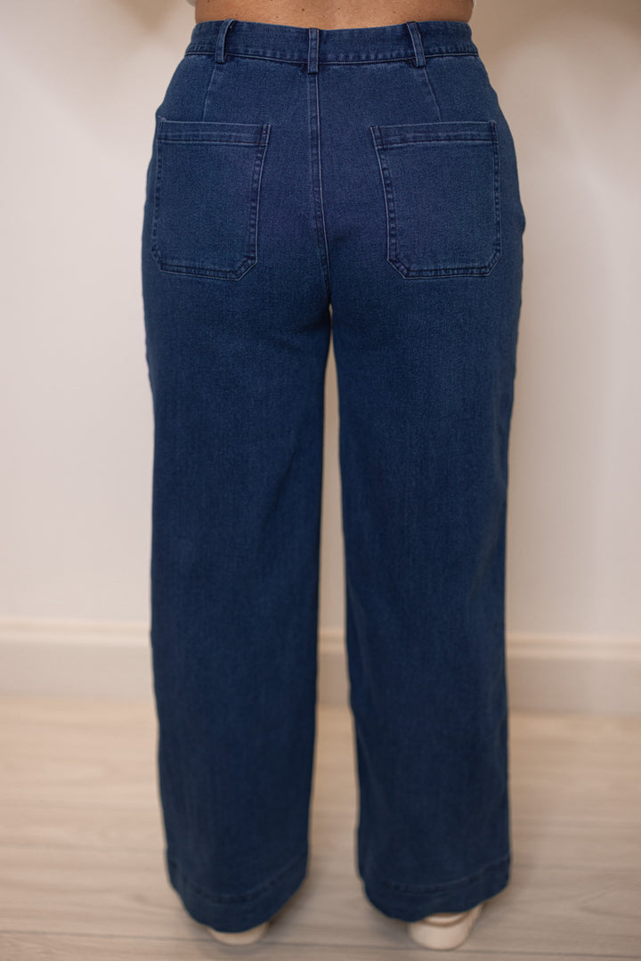 Women's dark washed blue denim wide leg jeans by Entro showing up close back view