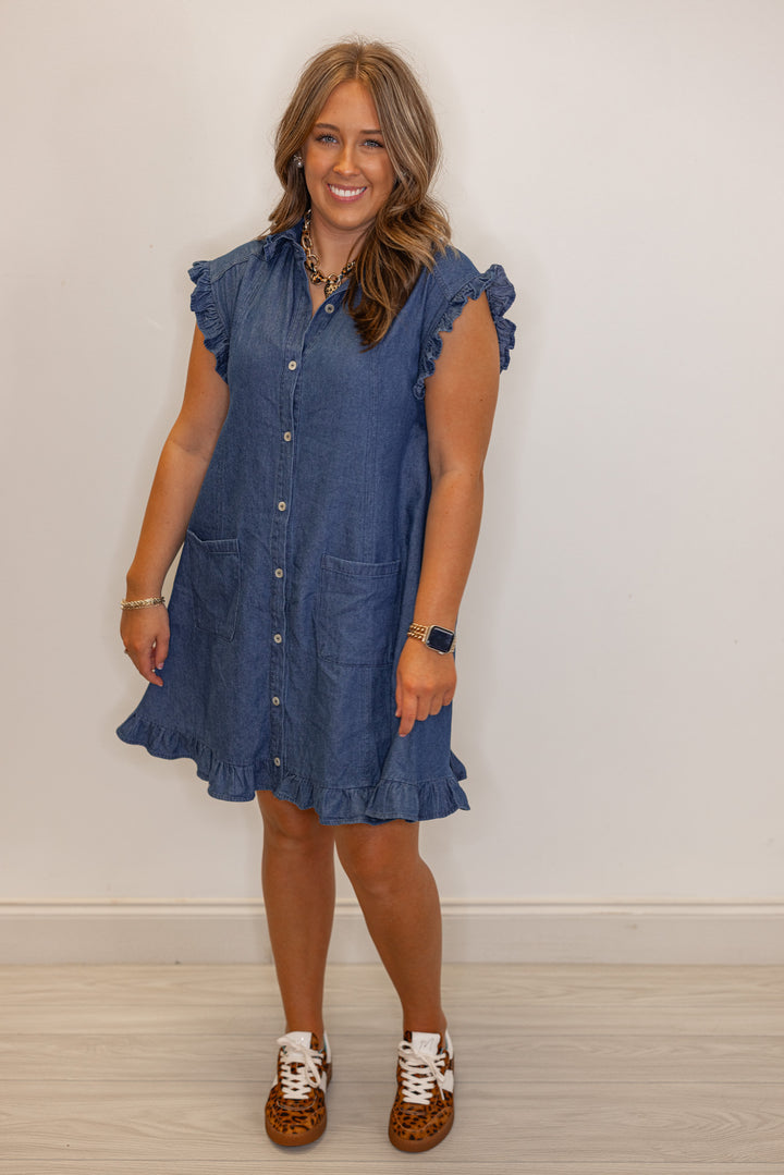 Dark blue denim button down dress with ruffle details by Entro showing relaxed silouhette