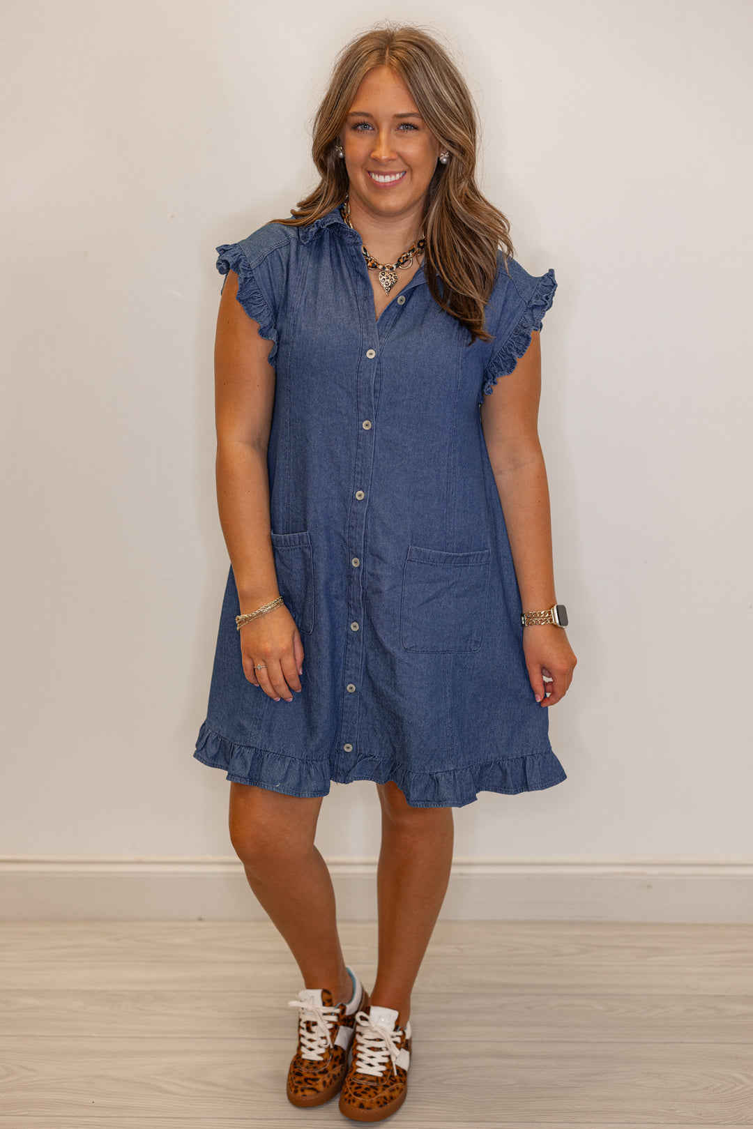 Dark blue denim button down dress with ruffle details by Entro