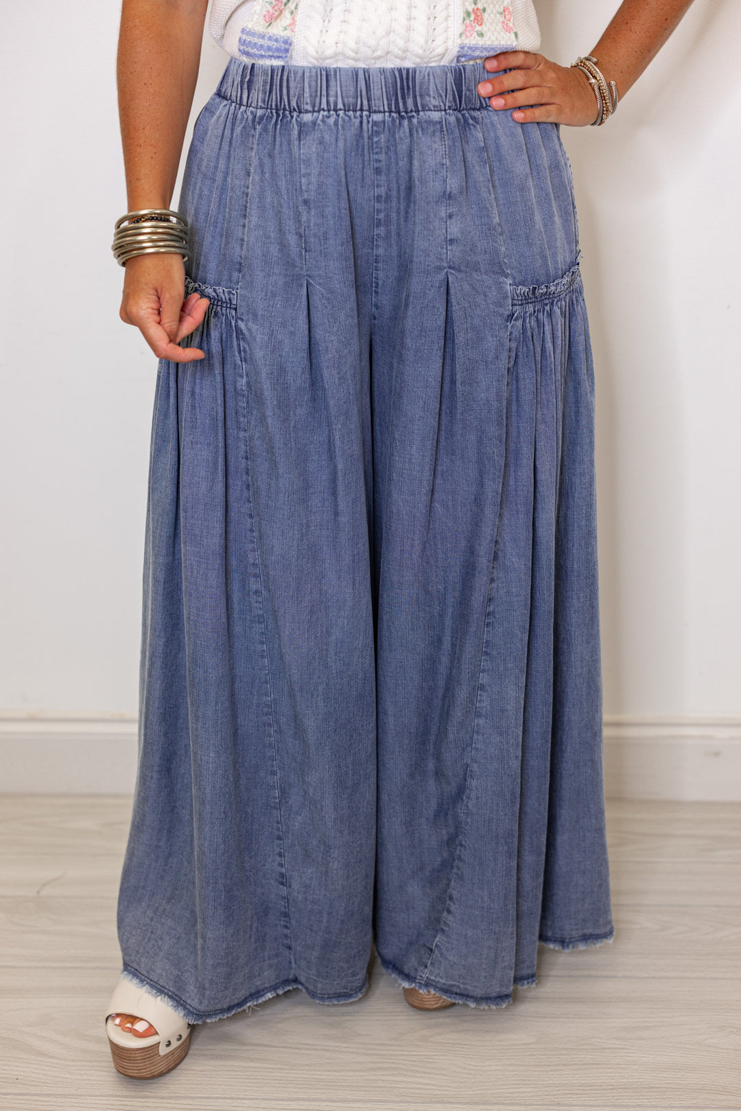 Palazzo style wide leg chambray denim pants in dark blue by Easel showing up close front view