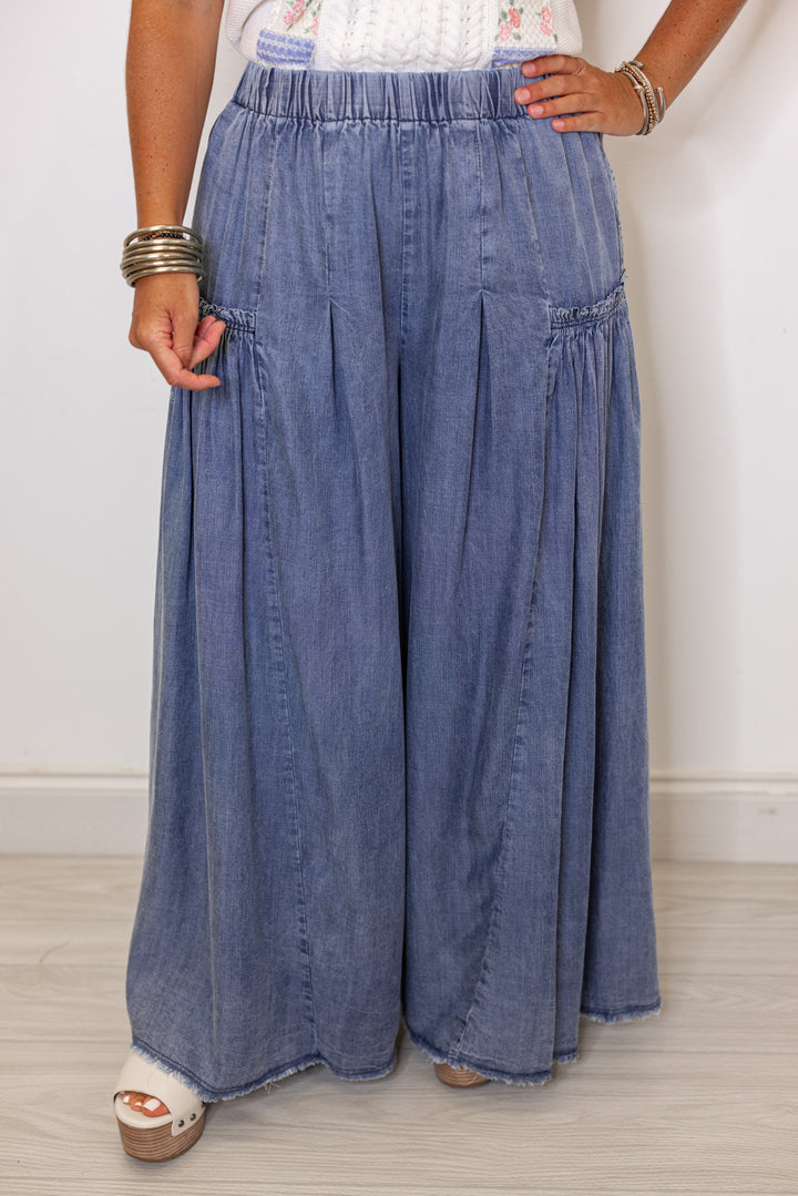Palazzo style wide leg chambray denim pants in dark blue by Easel showing up close front view