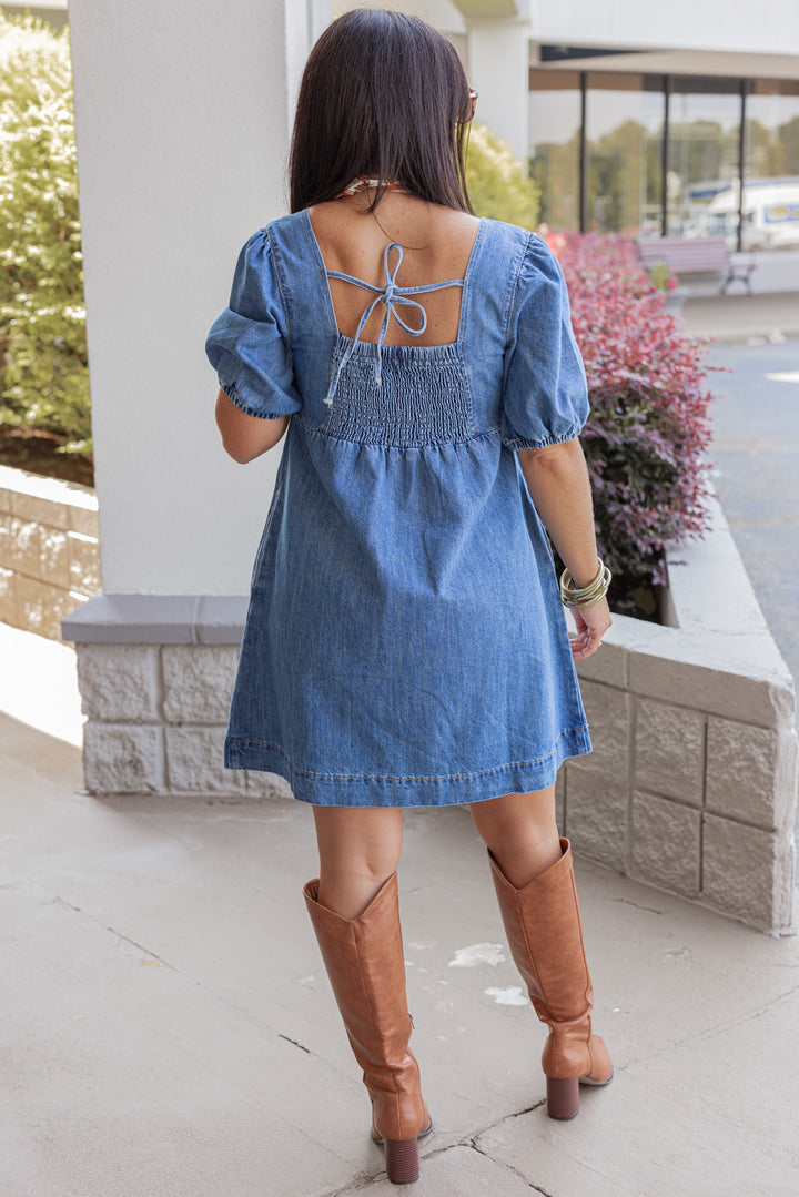 Women's denim puff sleeve dress with button front bodice by Wishlist showing full back view