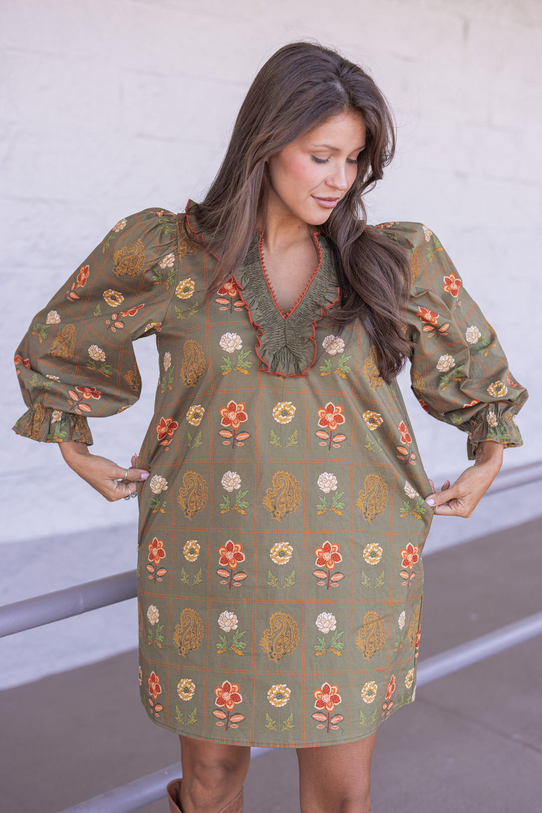 Women's olive dress with floral border print in orange and peach by Entro showing true to size fit