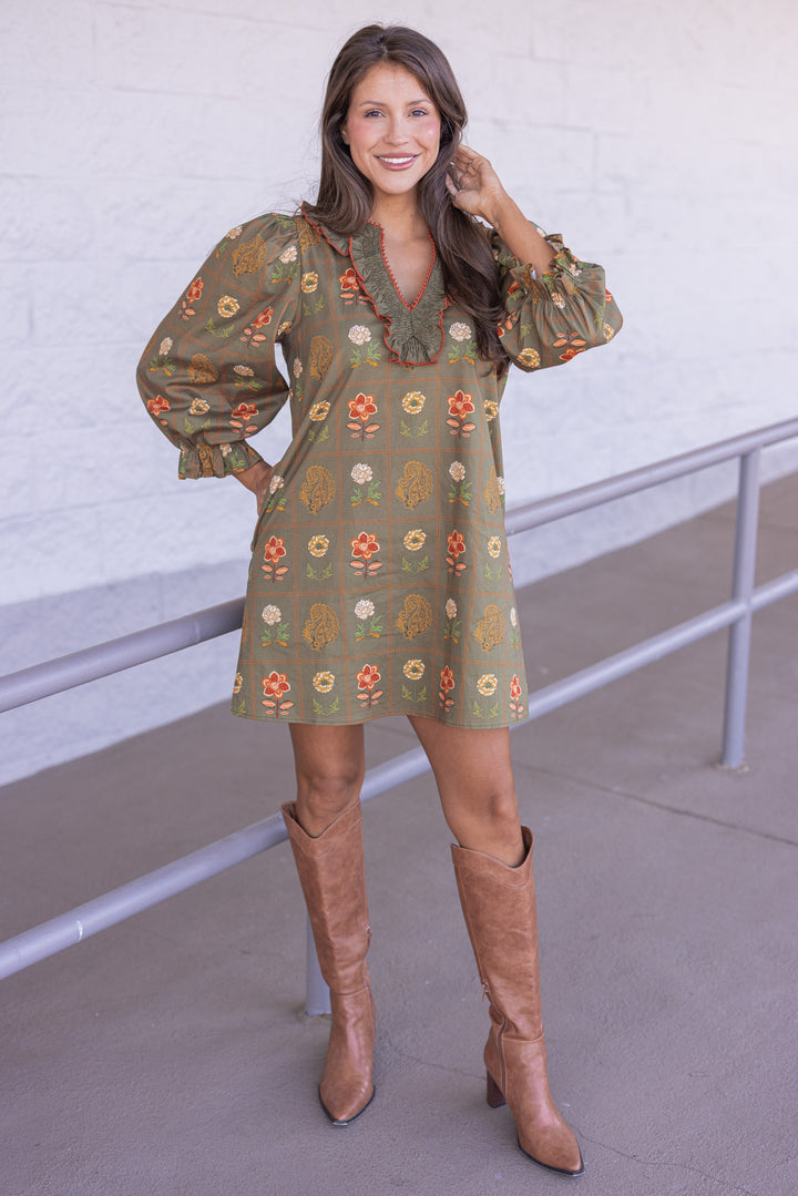 Women's olive dress with floral border print in orange and peach by Entro showing full front view