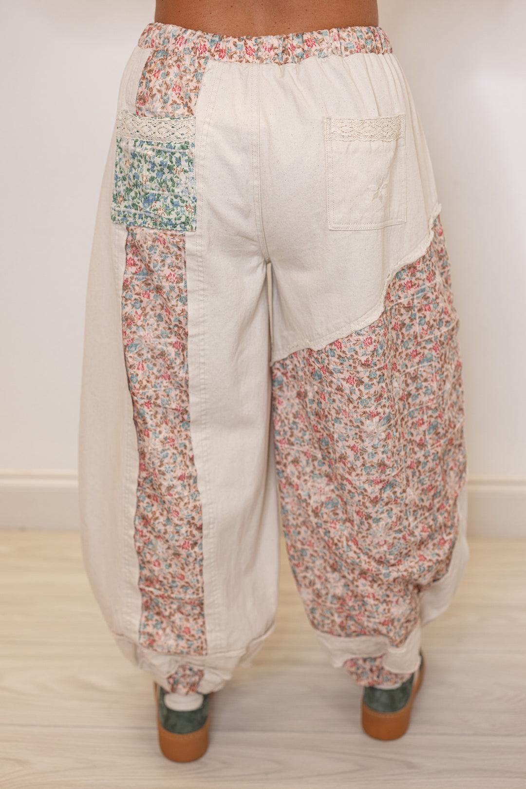 Women's oatmeal twill wide leg jogger pants with multicolor floral patches by POL showing up close back view