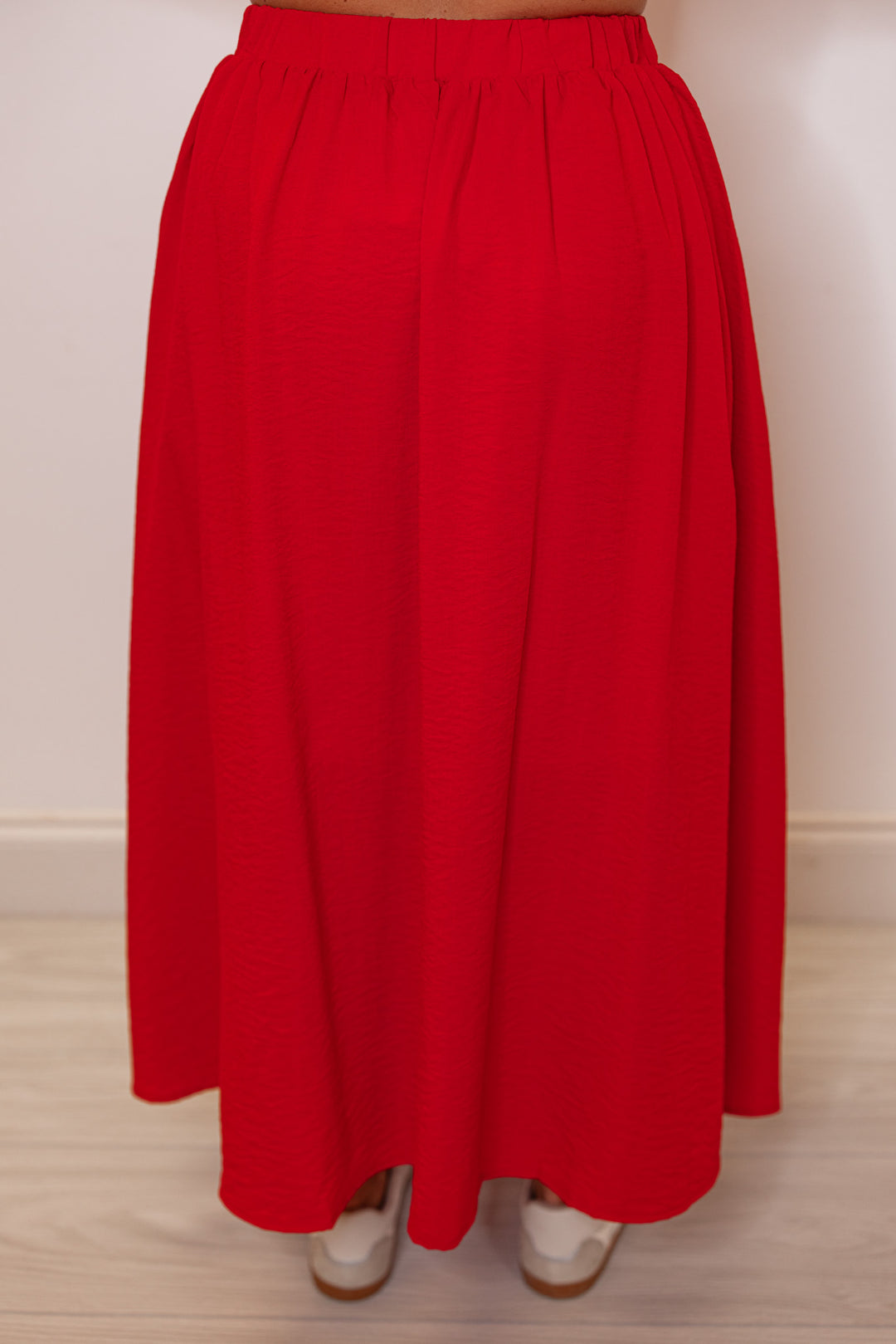 Women's red textured midi skirt with pleats by Entro showing up close back view