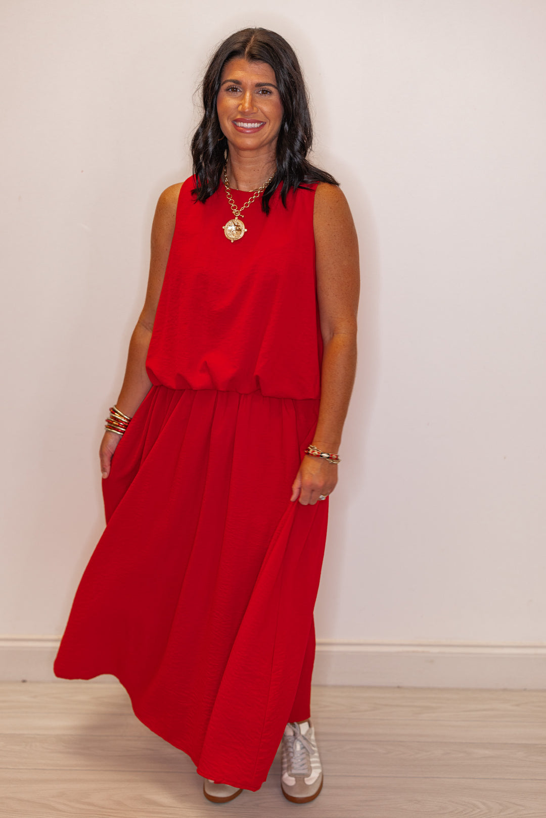 Women's trendy red textured bubble hem sleeveless crop top by Entro, perfect for GA gamedays