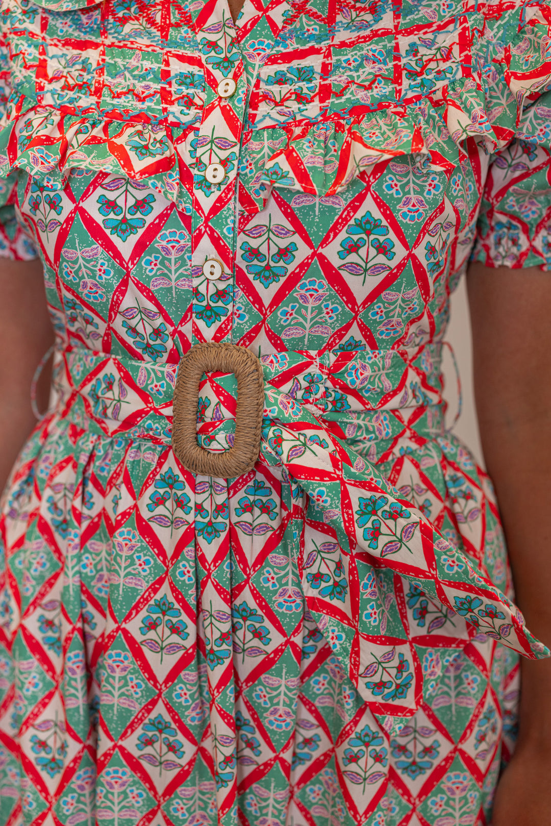 Women's green and coral pink floral print belted poplin maxi dress by Karlie showing up close view of belt detail