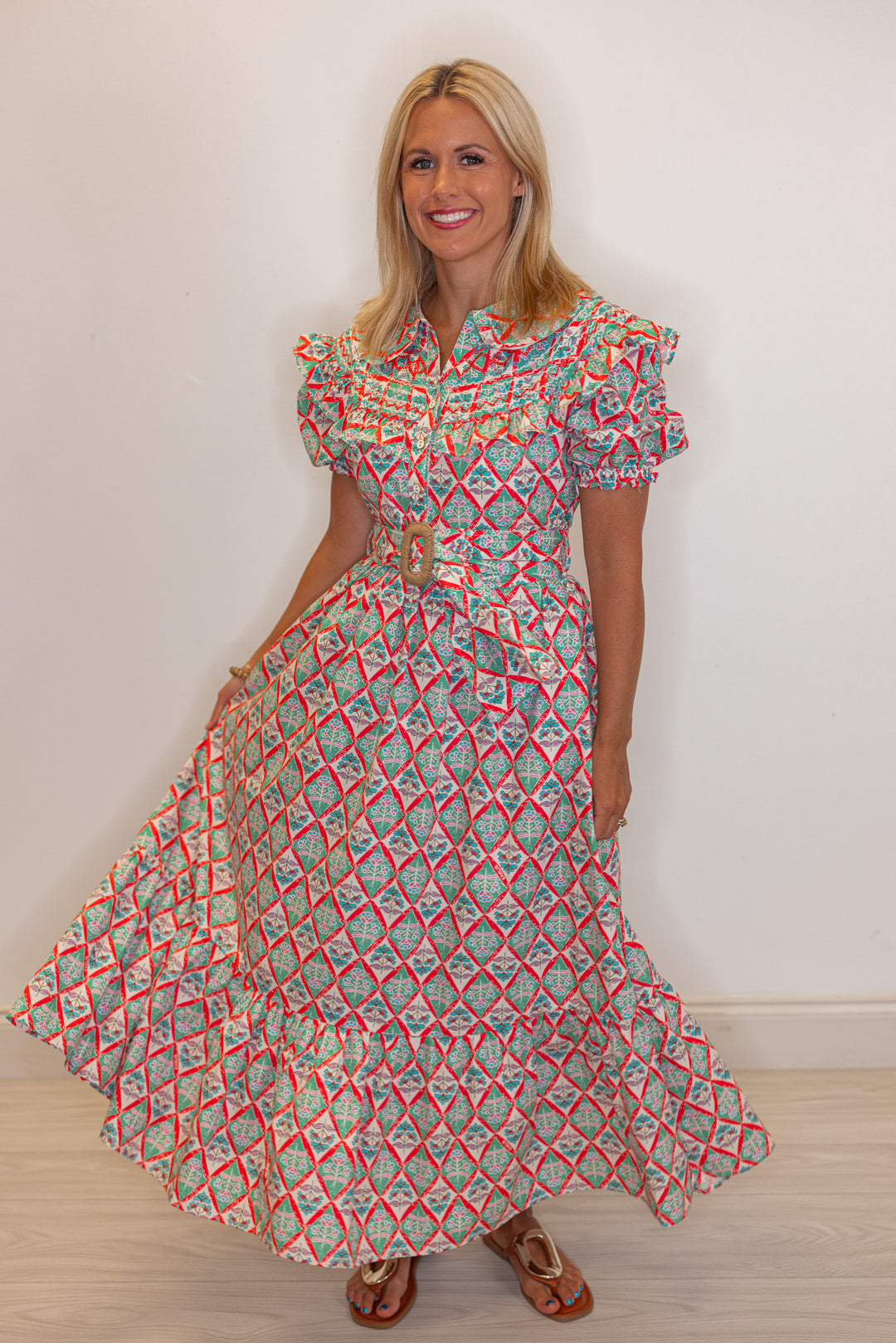 Women's green and coral pink floral print belted poplin maxi dress by Karlie showing skirts flowy silouhette 