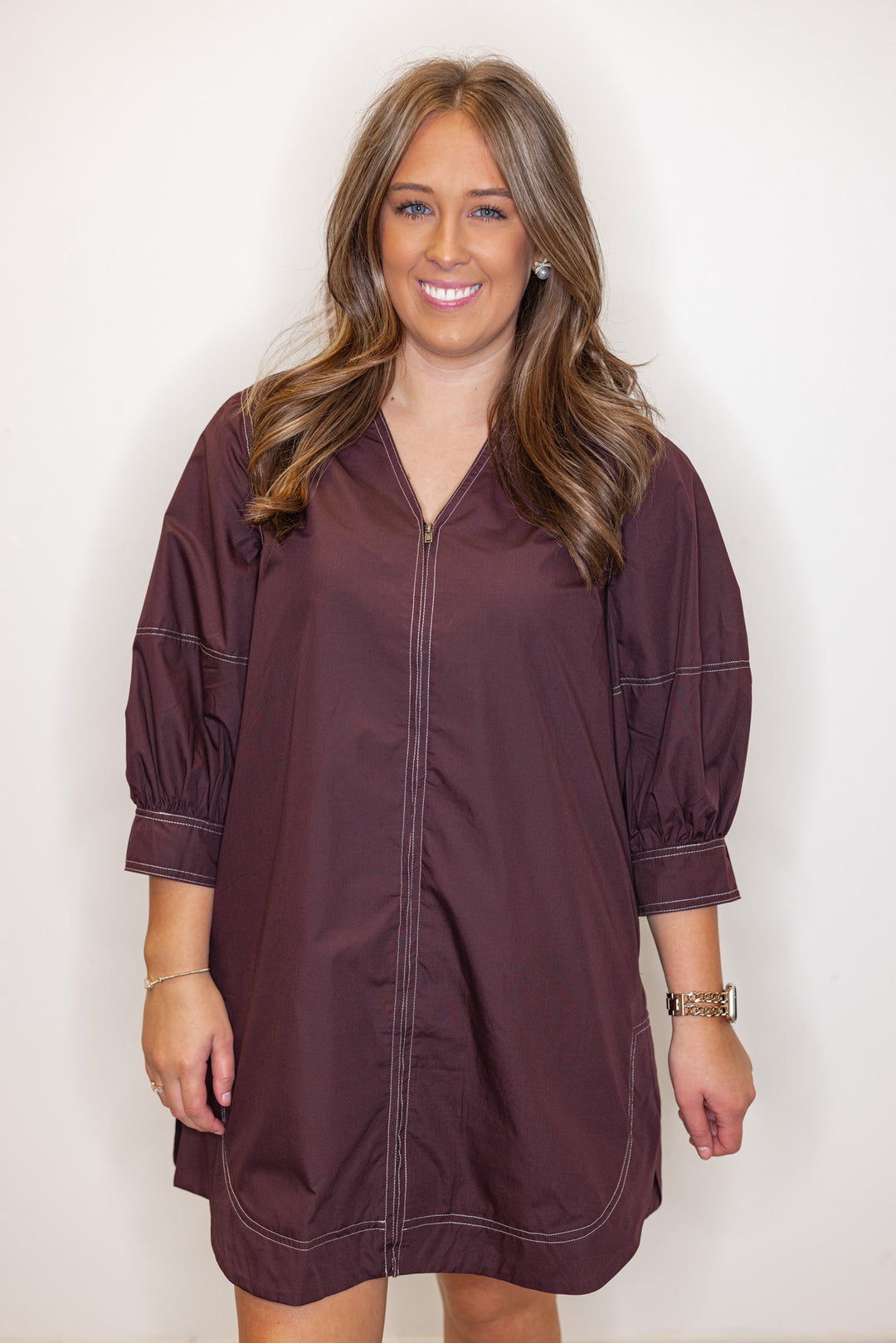 Women's chocolate brown mini dress with cream contrasting stitching throughout by Entro showing up close front view