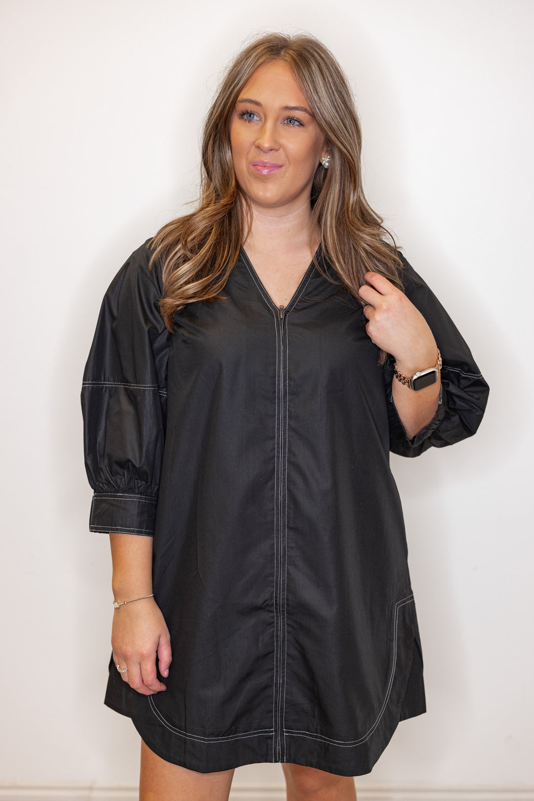 Women's black mini dress with cream contrasting stitching throughout by Entro