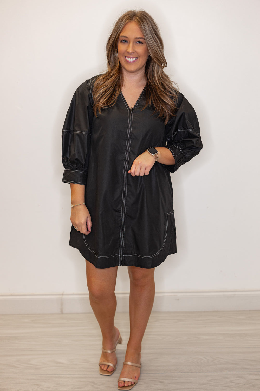 Women's trendy black mini dress with cream contrasting stitching throughout by Entro