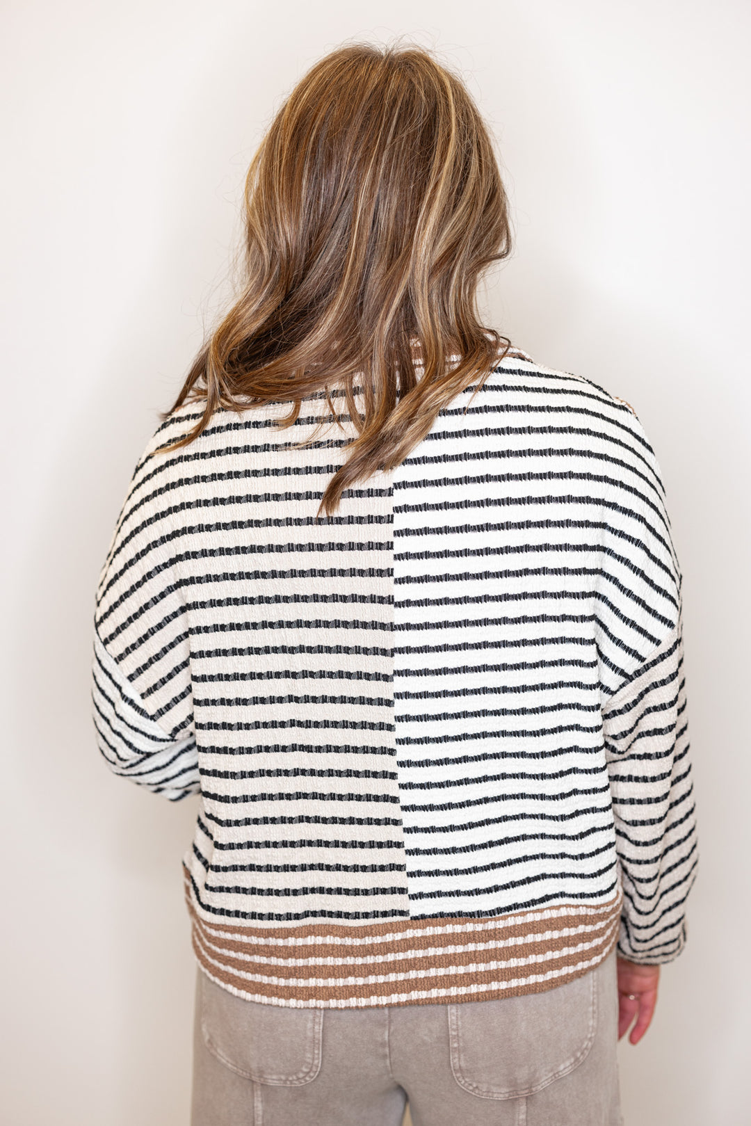 Women's taupe, cream and mocha colorblock half zip top with black stripes by Blu Pepper showing up close back view